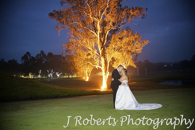 Wedding couple night shoot with uplight trees at Riverside Oaks - wedding photography sydney